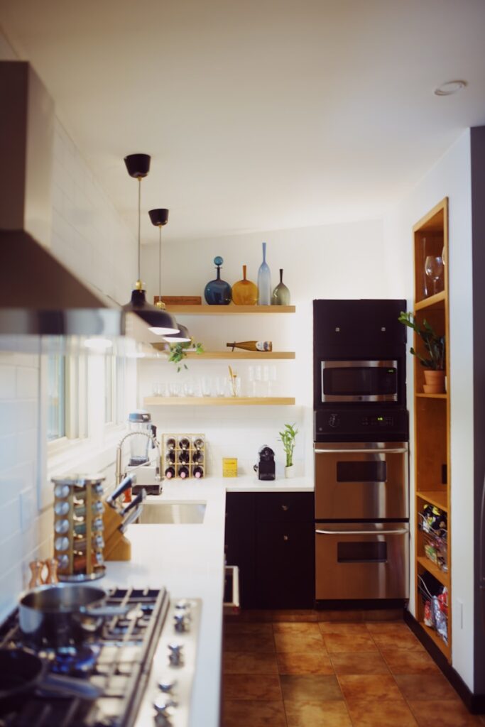 a kitchen with a stove top oven next to a counter