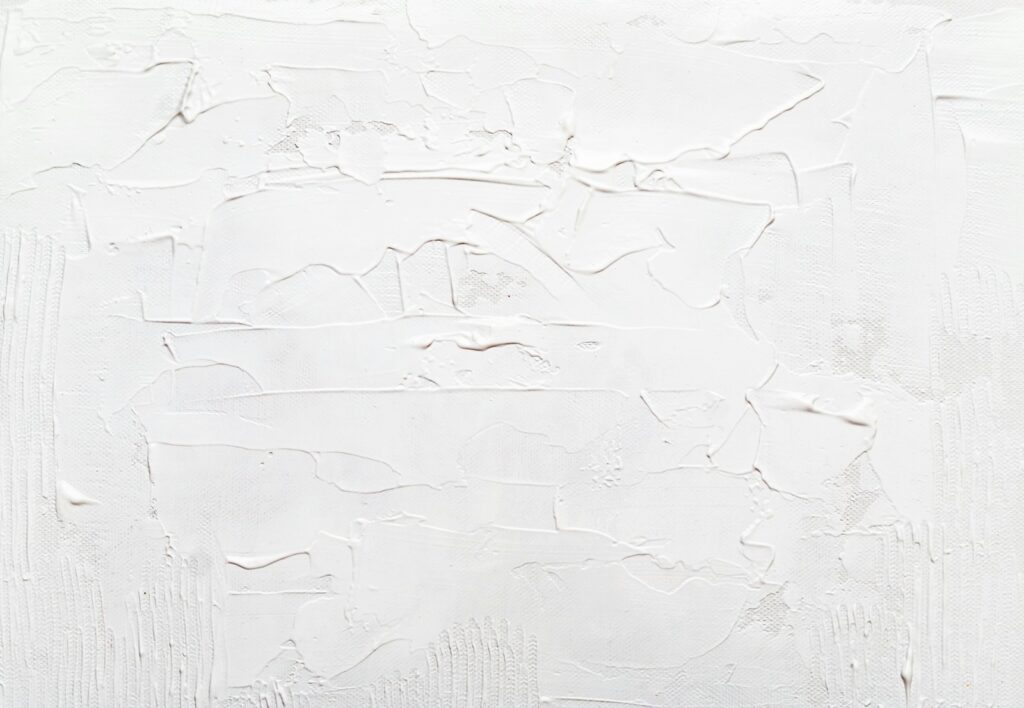 a white wall with some white paint on it